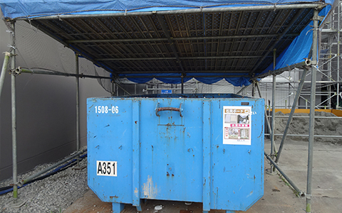 Yard for separating waste plasterboards (protected from rain by roof and sheets)