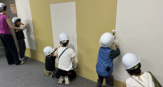 Participants trying their hand at construction work